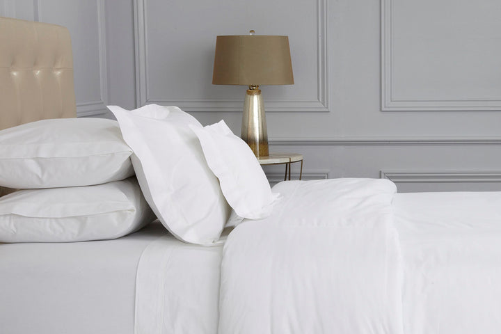 Peter Reed White Bedding on Bed