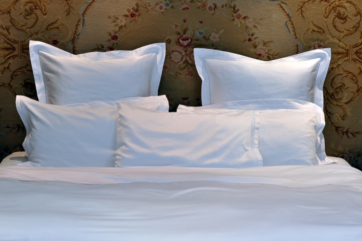 Peter Reed White Sheets on Bed