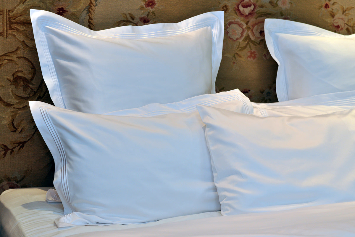 Peter Reed White Sheets on Bed