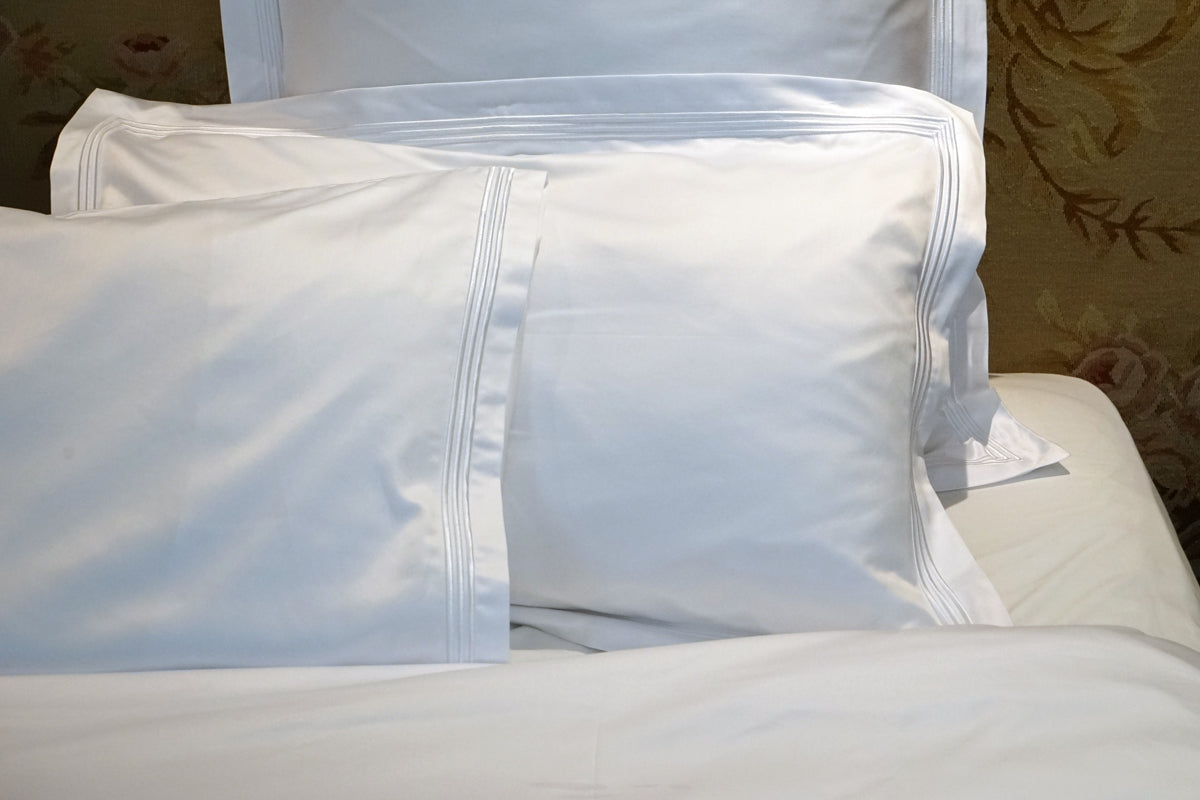 Peter Reed White Sheets on Bed