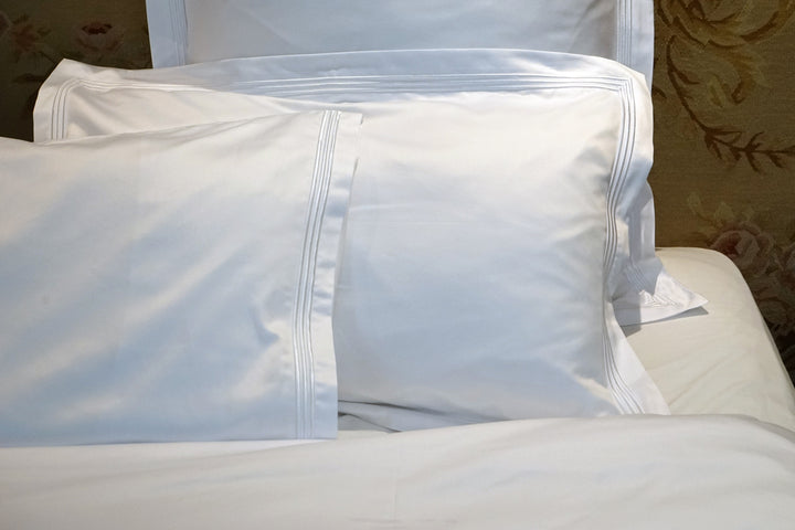 Peter Reed White Sheets on Bed