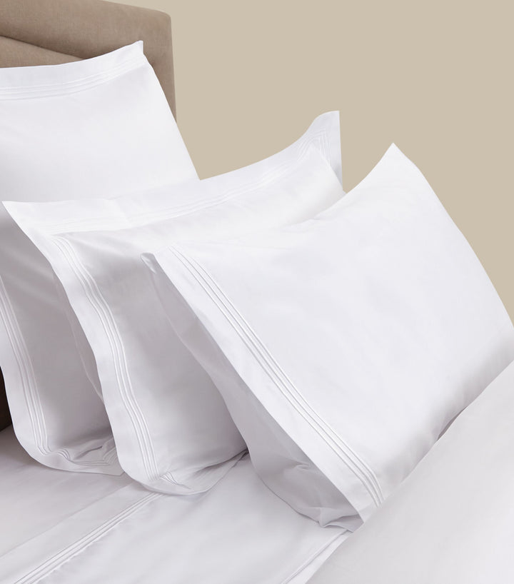 Peter Reed White Sheets on Bed