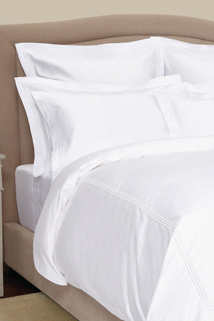 Peter Reed White Sheets on Bed