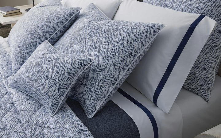 Matouk Lowell Bedding in Navy on crisp bed