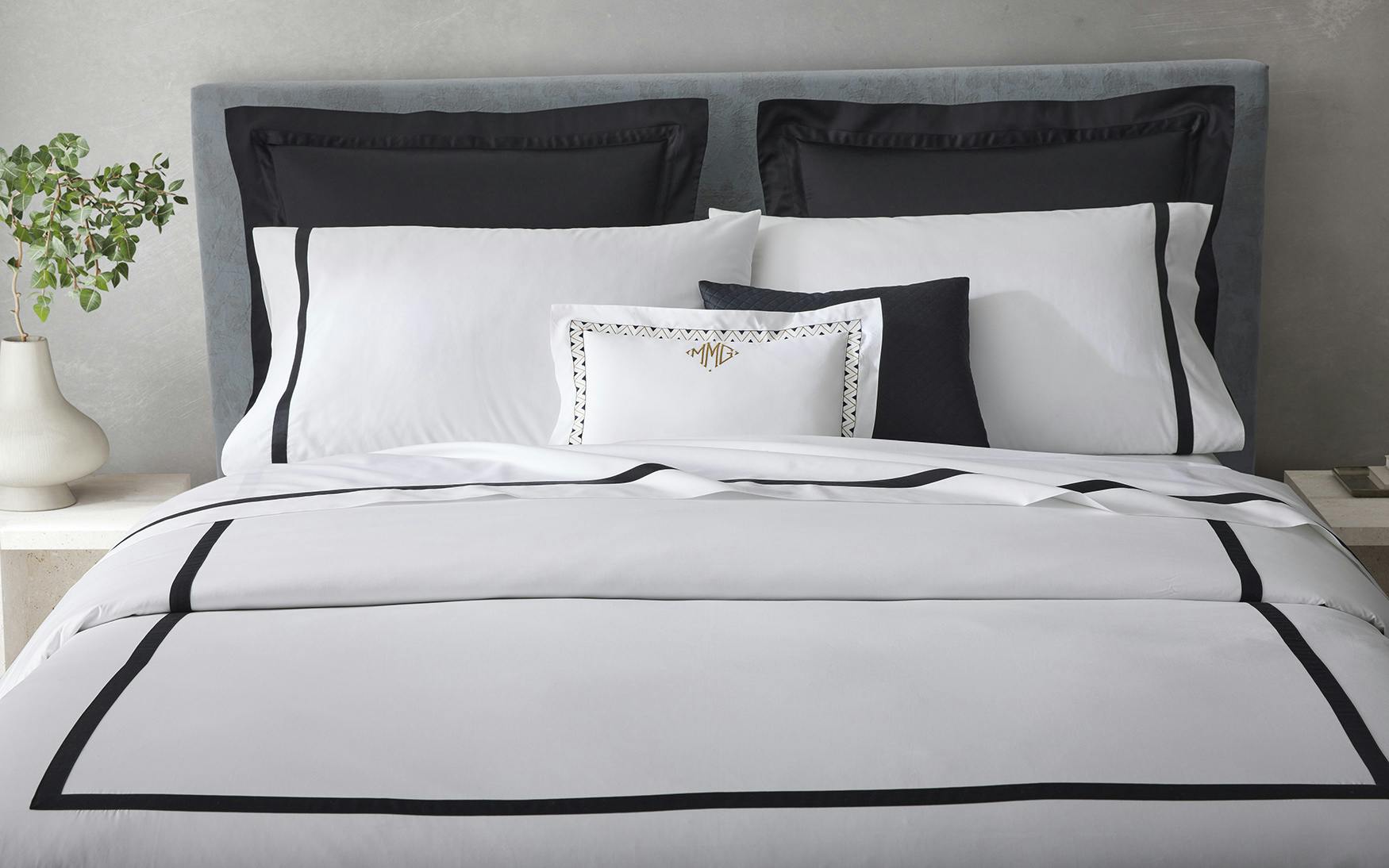 Neatly Made bed featuring Matouk Lowell Bedding