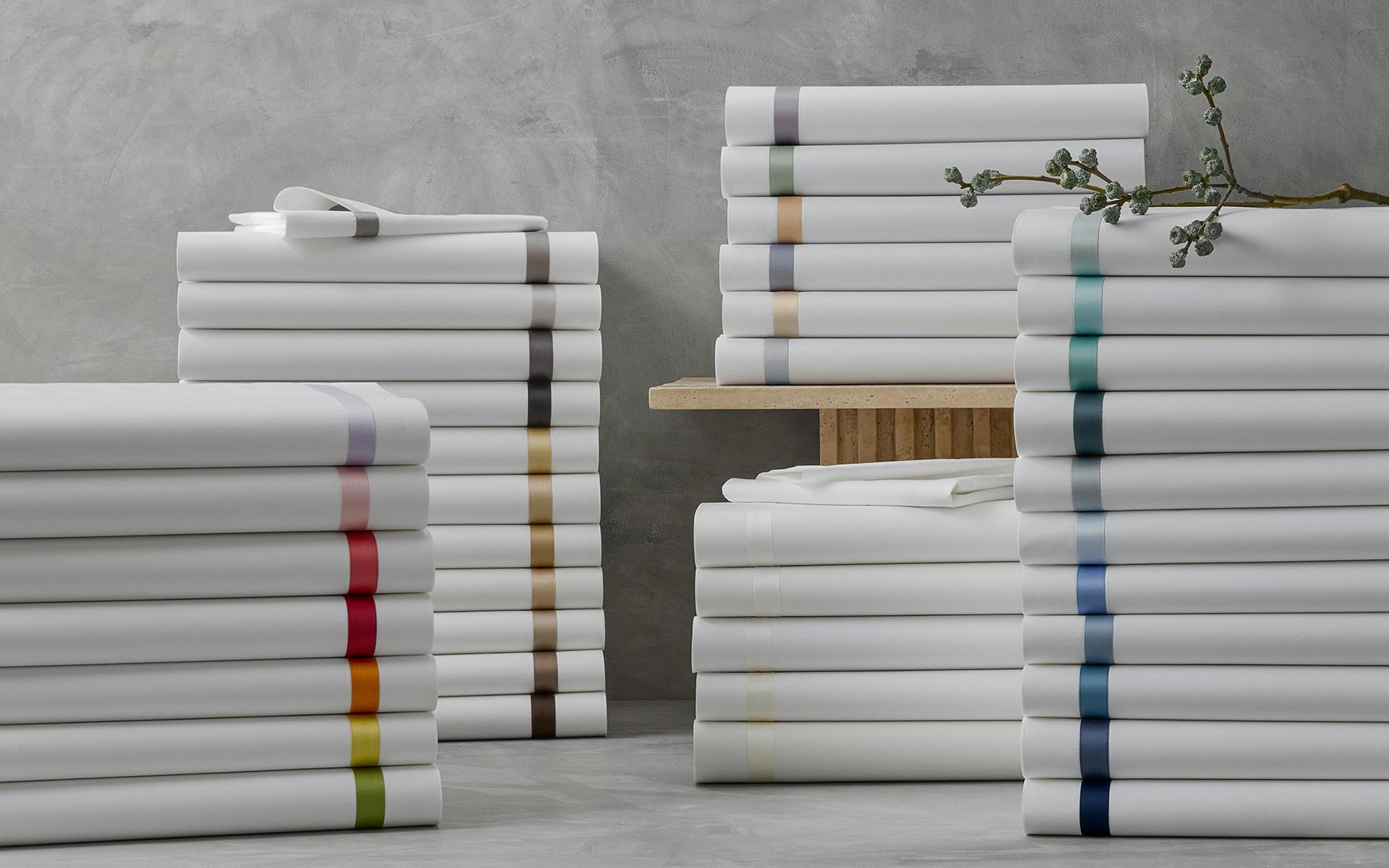 Stack of Matouk Lowell Bedding in Various Colours
