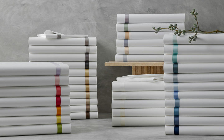 Stack of Matouk Lowell Bedding in Various Colours