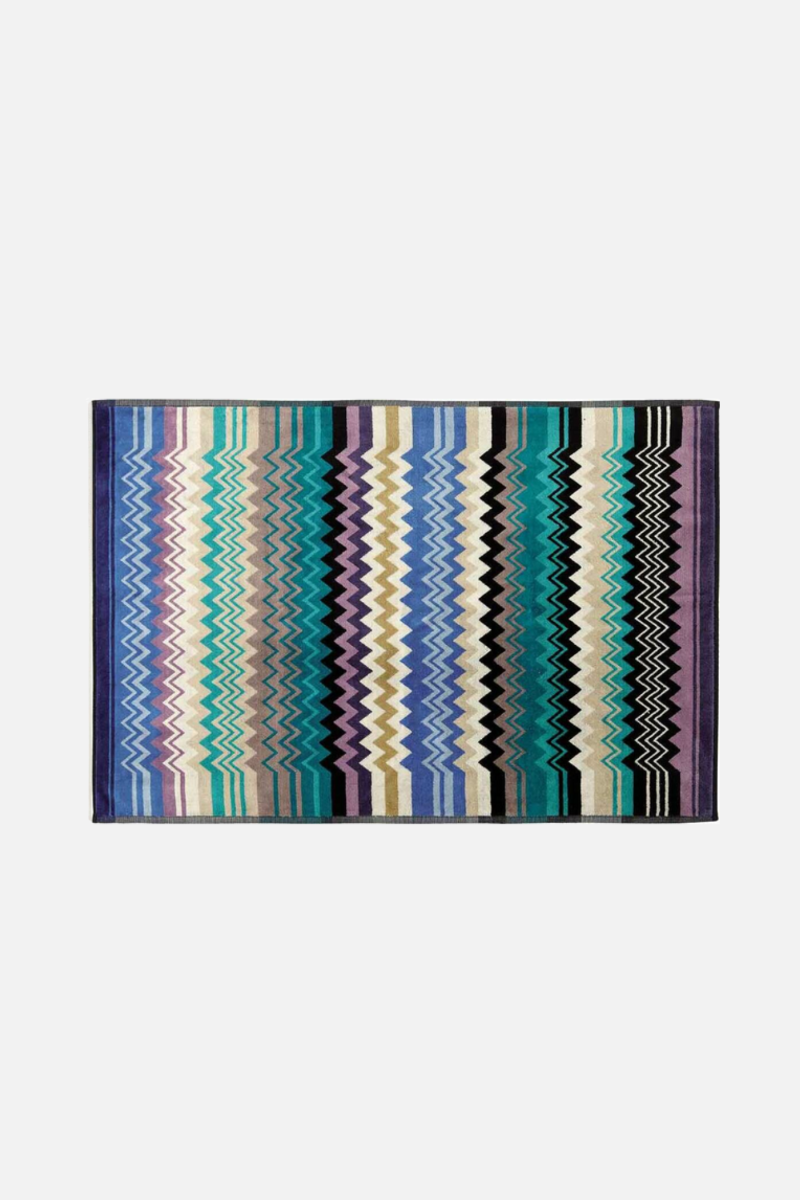 Multicolored striped rug on a white background