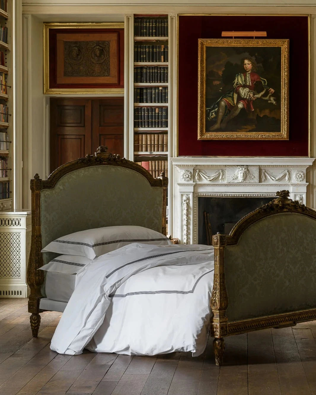 Peter Reed on bed in library