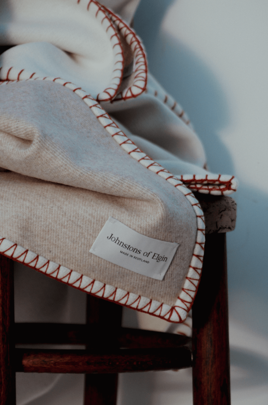 Johnstons of Elgin BlanketStich Throw on Chair