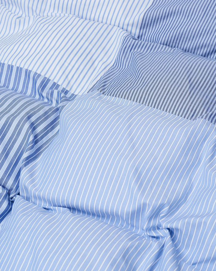 Close up of the Magniberg patchwork duvet cover in various stripes
