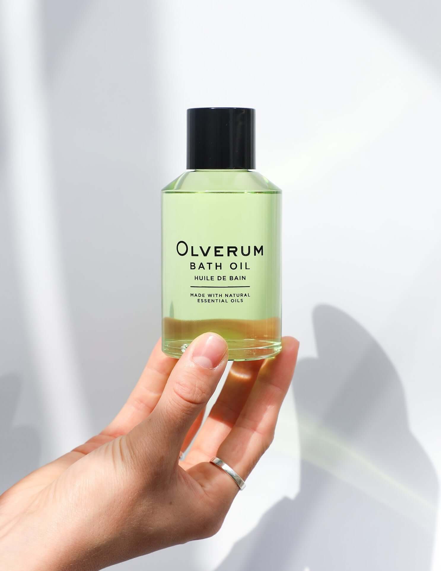 Olverum Bath Oil in hand