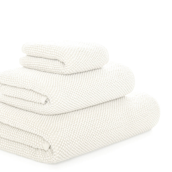 Graccioza Pearls Folded textured white towel on a white background