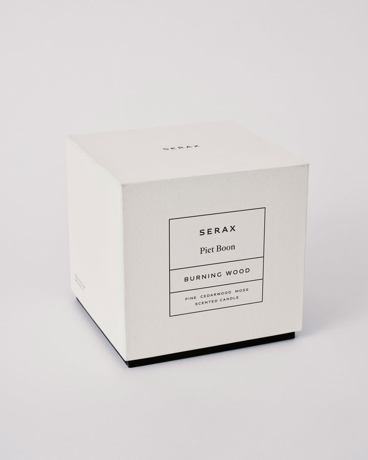 White candle box with 'Serax' branding on a light gray background