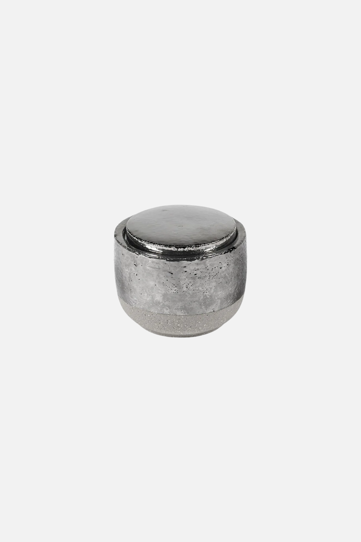 Metallic cylindrical object on a white background Serax Piet Boon