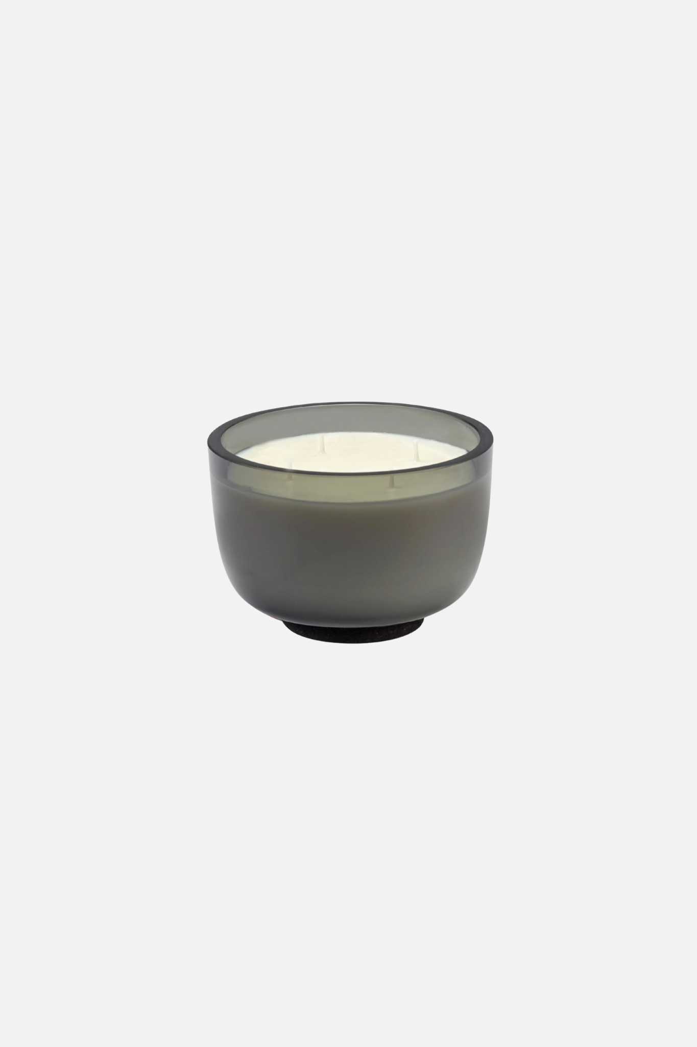 Gray candle in a glass container on a white background