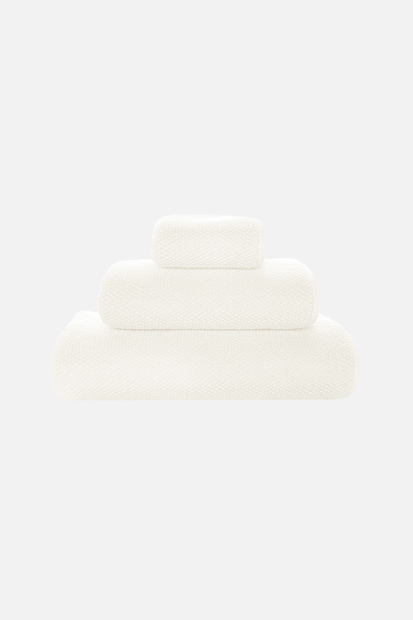 Graccioza Pearls Stack of white towels on a light gray background