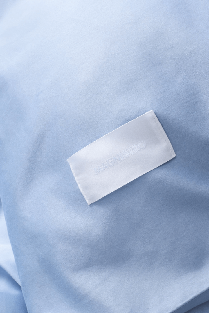 Close up of the Magniberg haze blue pillowcase with Magniberg label